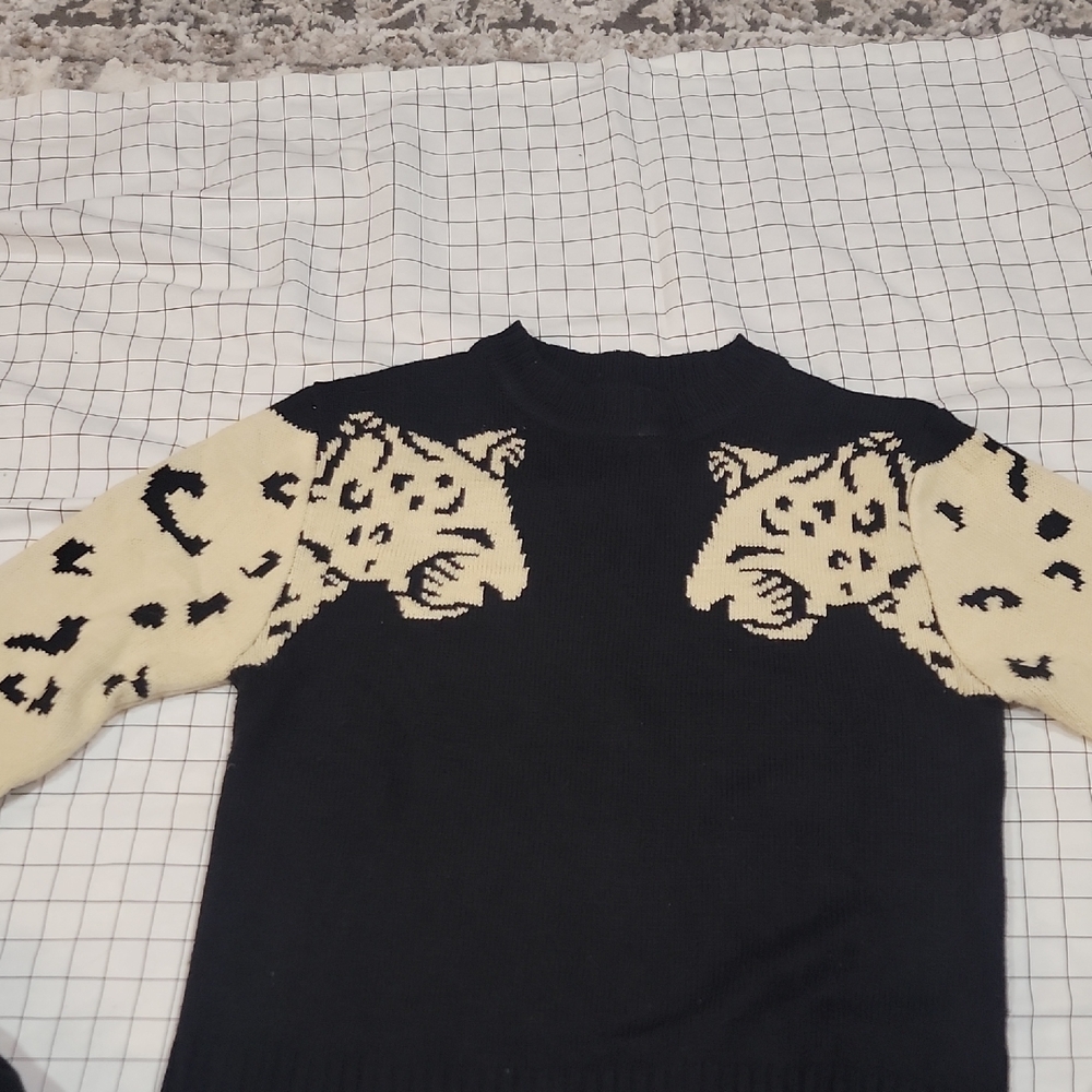 Elegant Black and Cream Leopard Sweater